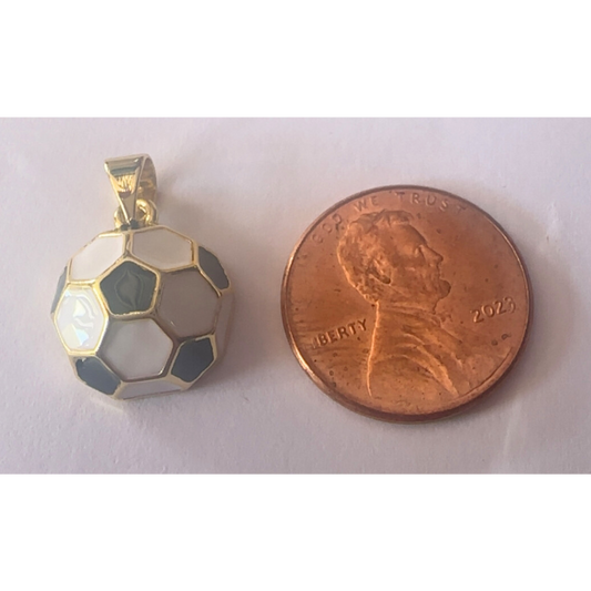 soccer ball charm next to a penny on a white background