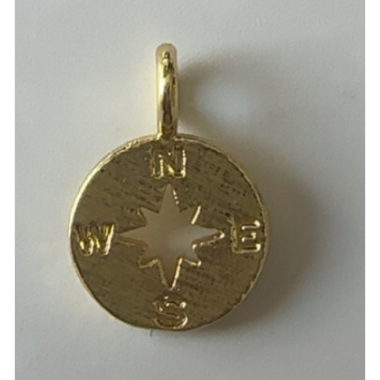 Gold compass pendant on a white background